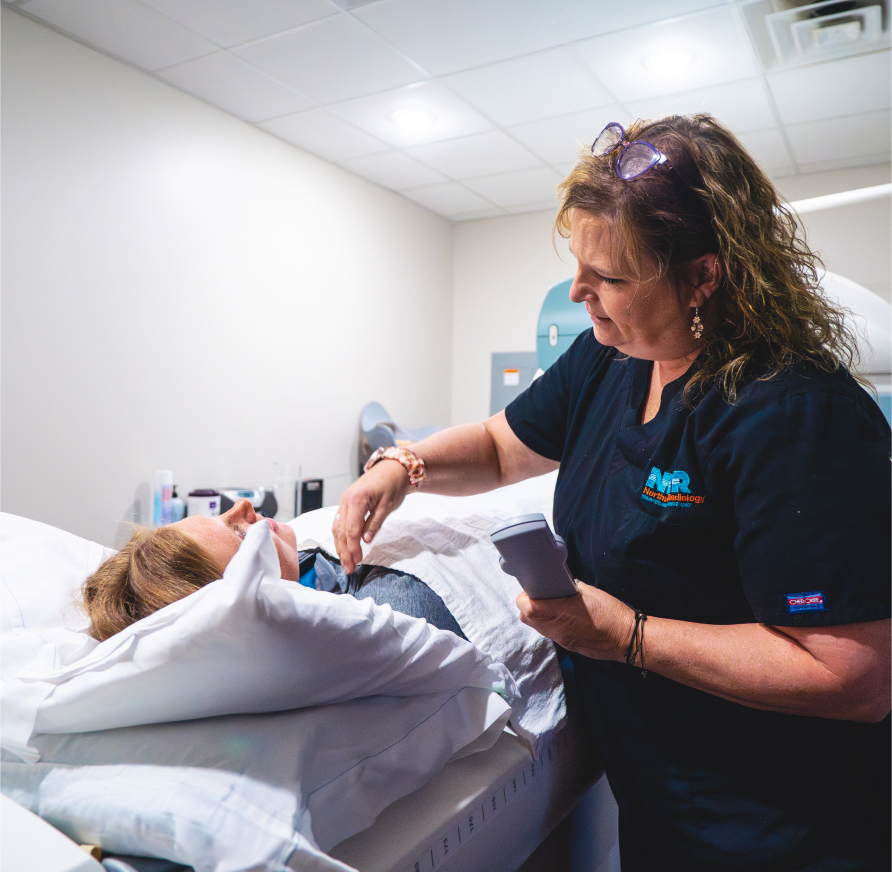 Northwest Radiology  tech assisting a patient